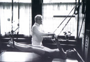 Joseph Pilates working on the cadillac